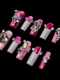 Faux ongles avec gros strass bling bling, cat eyes et french